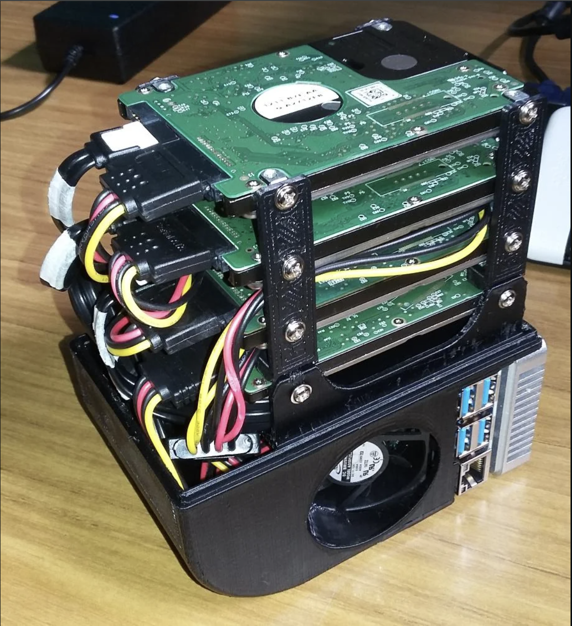 Homemade Raspberry Pi NAS with hard drives and acrylic housing